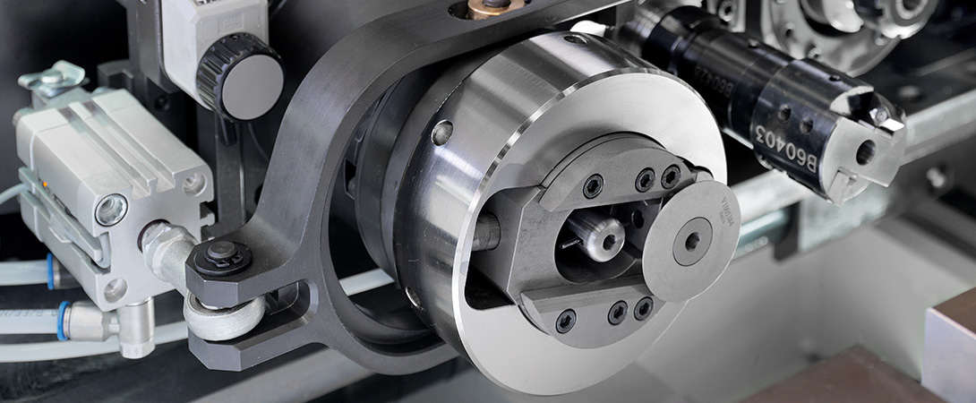 Orbital scoring system on all-electric tube end-forming machines. Orbital scoring system on all-electric tube end-forming machines.